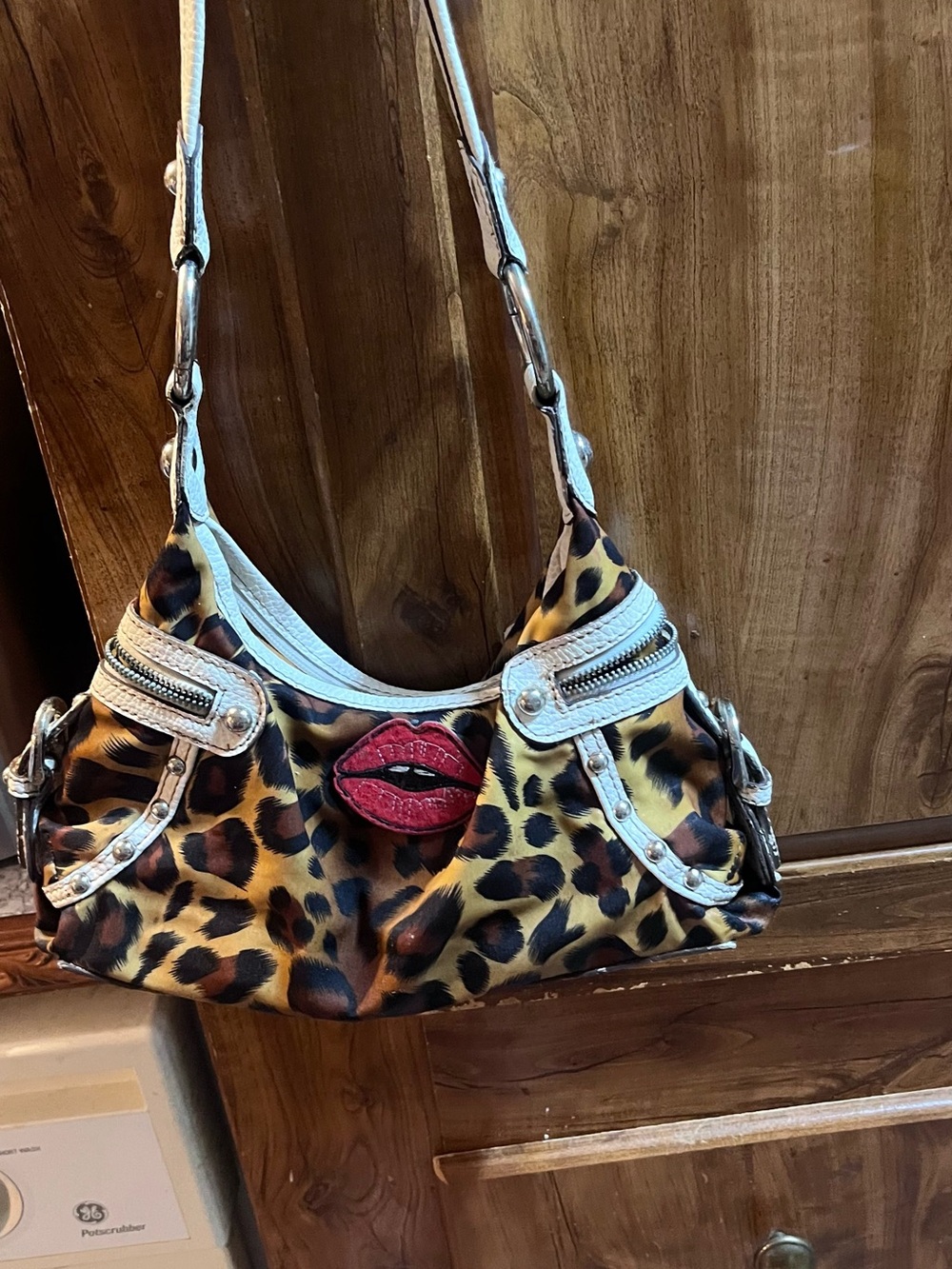 Leopard Print Shoulder Bag with Red Lip Accent Kathy van zeeland